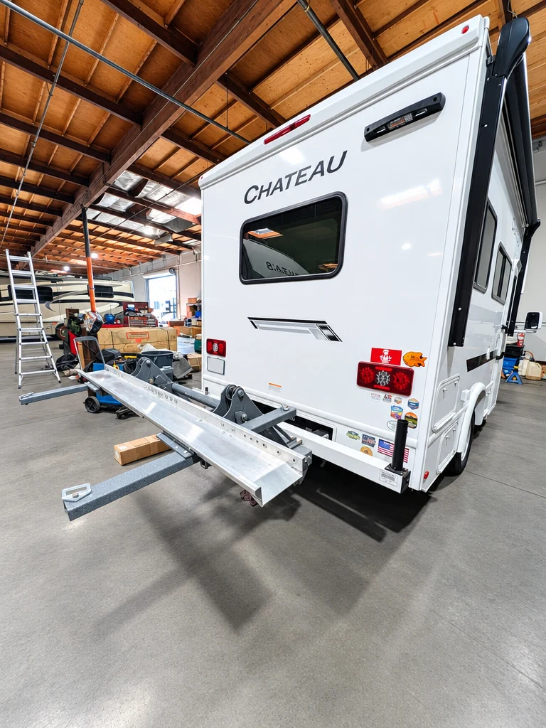 Rear of a Class C motorhome with a hitch cargo carrier