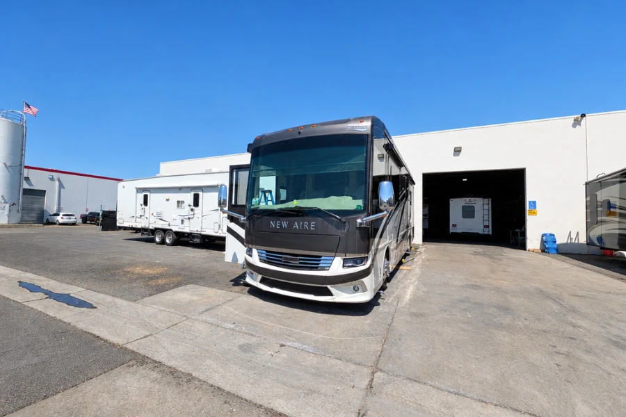 Class A motorhome pulling up to the shop door at El Toro RV Service