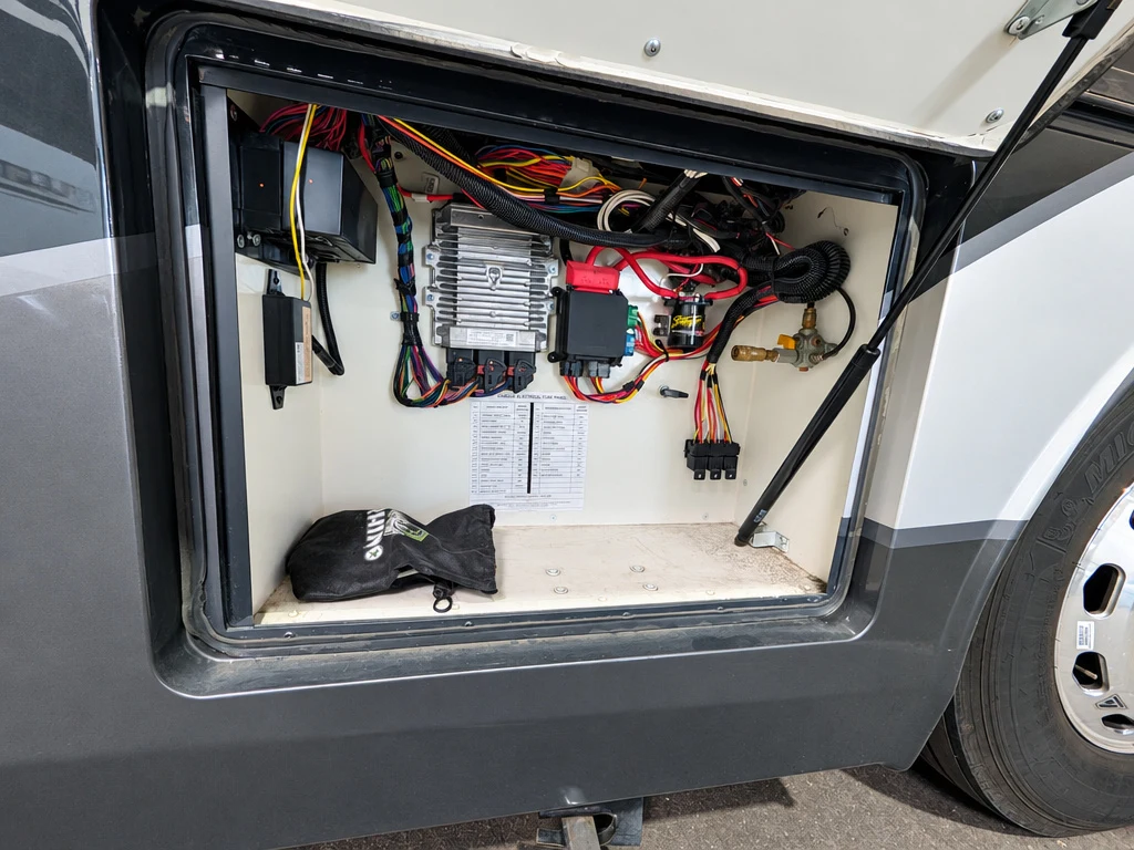 Motorhome electrical compartment with converter and wiring at El Toro RV Service