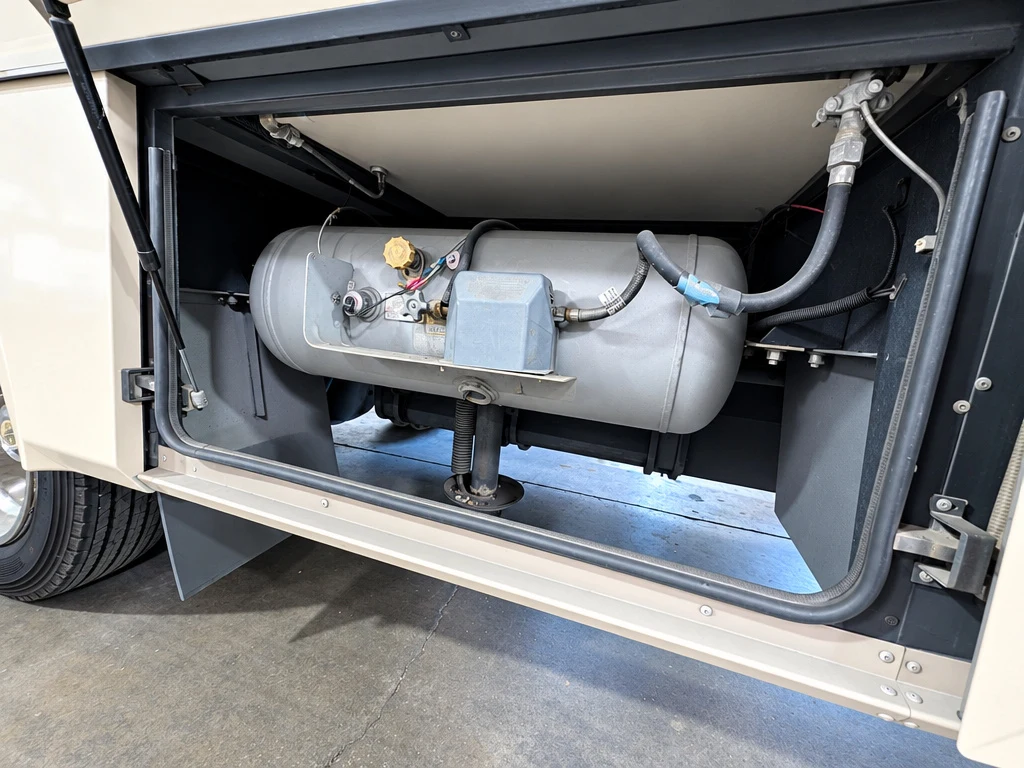 RV propane tank compartment opened for LP system inspection