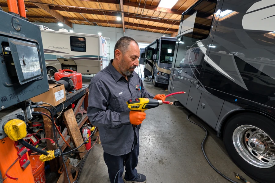 El Toro RV Service technician testing an RV electrical system with a meter